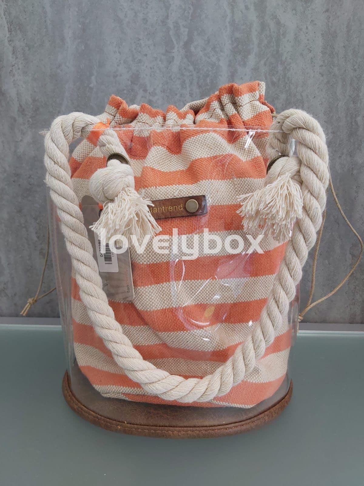 BOLSO REDONDO TRANSPARENTE CON SACO RAYAS TANTREND - Imagen 1