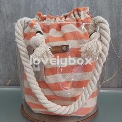 BOLSO REDONDO TRANSPARENTE CON SACO RAYAS TANTREND - Imagen 1