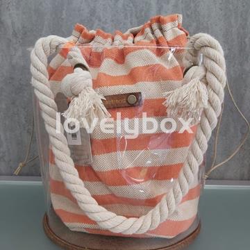 BOLSO REDONDO TRANSPARENTE CON SACO RAYAS TANTREND - Imagen 1