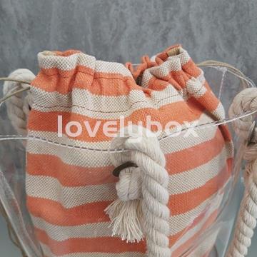 BOLSO REDONDO TRANSPARENTE CON SACO RAYAS TANTREND - Imagen 2